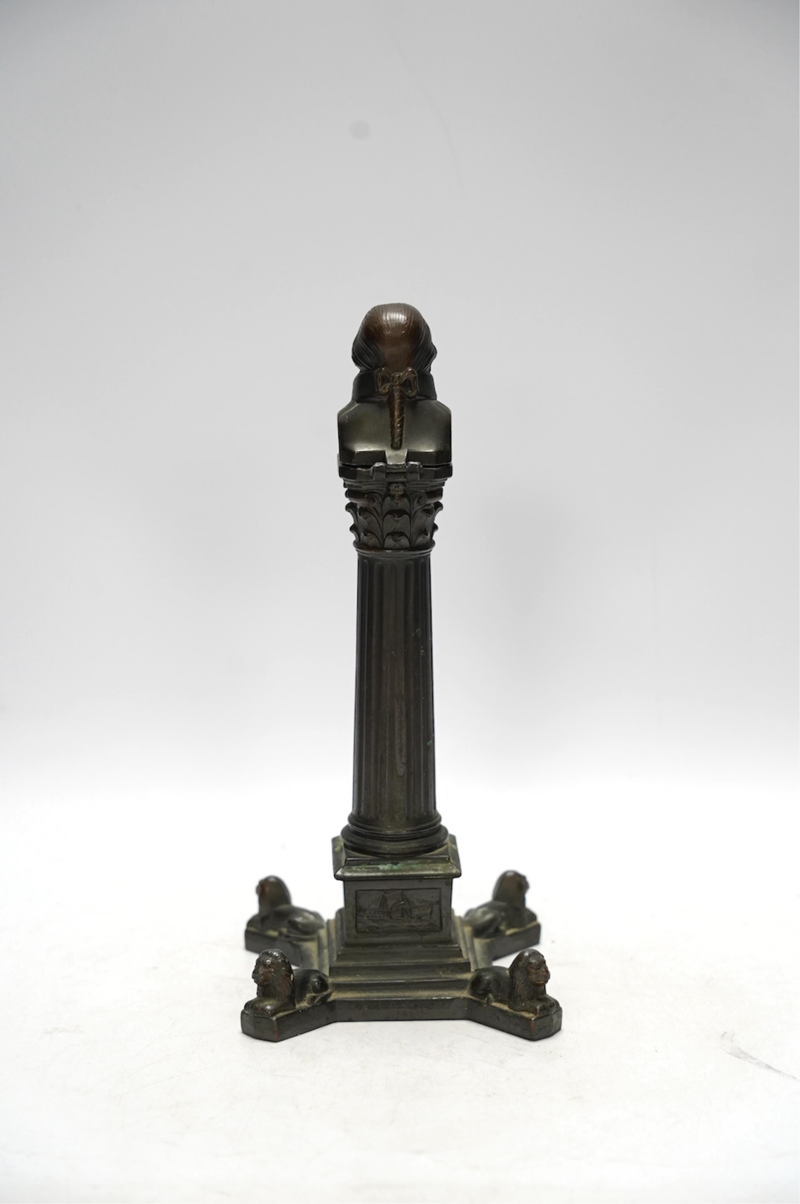 A spelter bust of Lord Nelson on a column table lighter, 25cm high. Condition - poor to fair, hinge broken, untested